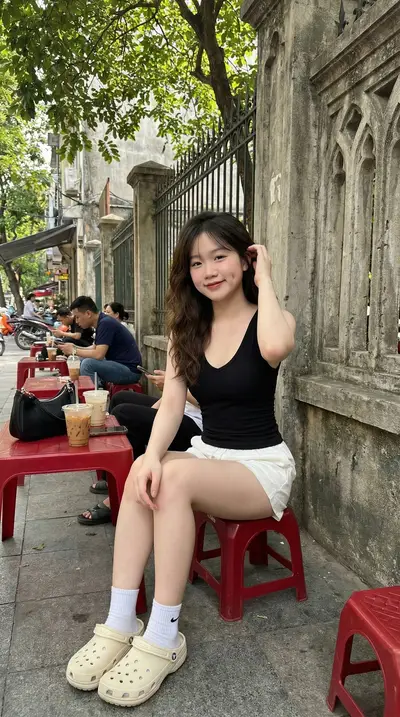Black V-Neck Tank Top Hanoi Sidewalk Cafe Portrait Prompt — Midjourney prompt variation 4