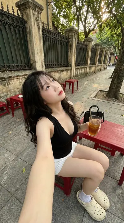 Black V-Neck Tank Top Hanoi Sidewalk Cafe Portrait Prompt — Midjourney prompt variation 9