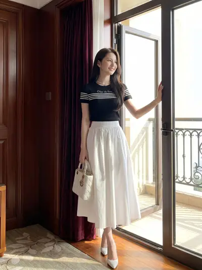 Black Graphic Tee White Midi Skirt Luxury Hotel Lookbook